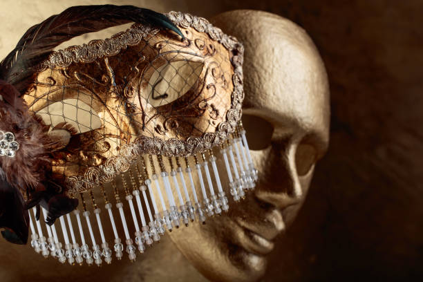istock Two golden carnival masks . 1136424681