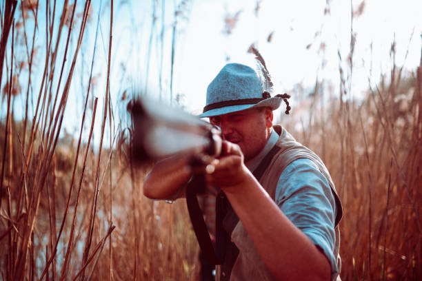 istock Male Hunter Preparing  To Shoot 1136425284