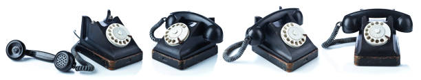 старый черный телефон изолирован на белом. - 1950s style telephone image created 1950s rotary phone стоковые фото и изображения