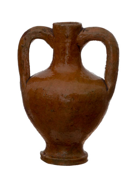 istock Rustic terracotta amphora, urn vase. Isolated on white background. Pitcher with handles. 1136425908