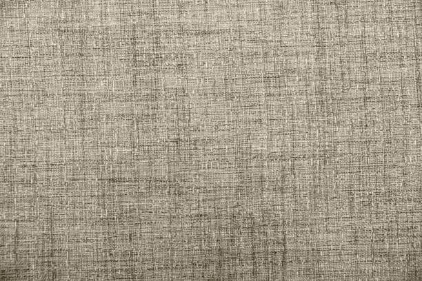 istock Hessian sackcloth burlap woven texture background / cotton woven fabric background with flecks of varying colors of beige and brown. with copy space. office desk concept. 1136427632
