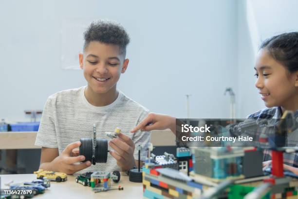 Junior High School Students Working In Stem Makerspace Building With Robotic Kits Stock Photo - Download Image Now