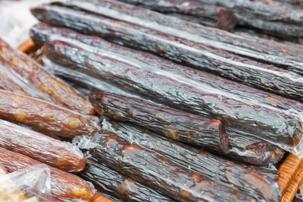 istock smoked sausages in plastic packaging closeup 1136433032