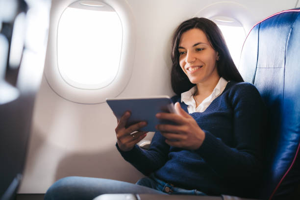 istock Watching movie on an airplane 1136434647