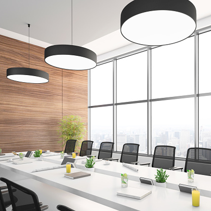 Wooden conference room interior with meeting table and armchairs, grey concrete floor. Board with laptop and tv display on wall, panoramic window on Kuala Lumpur. 3D rendering