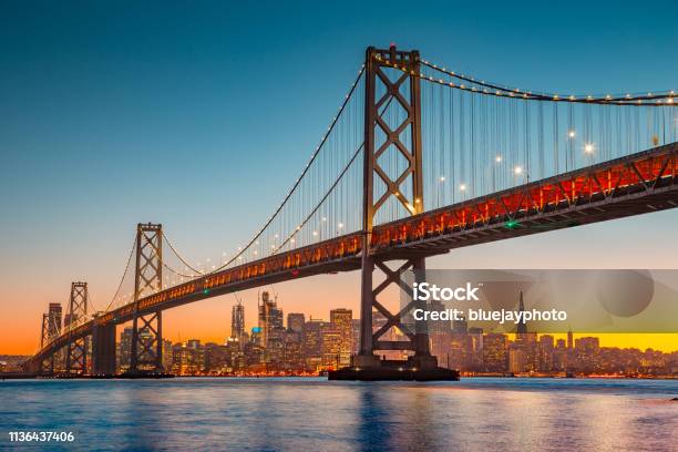 San Francisco Skyline With Oakland Bay Bridge At Sunset California Usa Stock Photo - Download Image Now