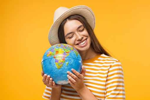 https://media.istockphoto.com/id/1136438182/photo/planet-care-save-the-earth-concept-cheerful-young-woman-hugging-globe-isolated-on-yellow.jpg?b=1&s=170667a&w=0&k=20&c=3yfhALksKqvYMwBah5Zn34t_mz4cG4SUukKxJr1d8W0=