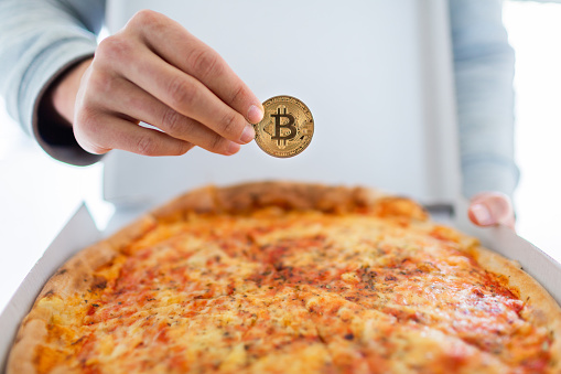 Slovenia, 02.25.2019 - Bitcoin pizza day anniversary. The first reported exchange of cryptocurrency for a consumer product on May 22, 2010.