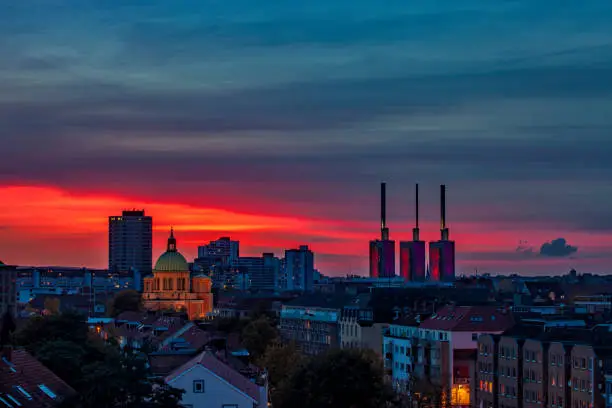 Hanover city skyline with electric pwer station on colorful sunset sky