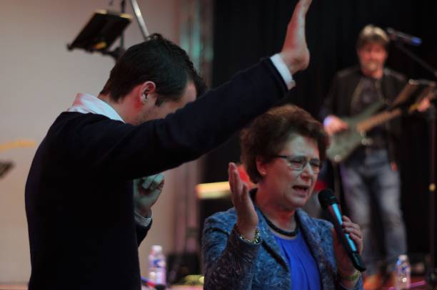 Testimony in Church Brunssum, the Netherlands, - March 04, 2018. Testimony during a worship concert, organised for the youth of the local Pentecostal Church. church like a holy light from god stock pictures, royalty-free photos & images