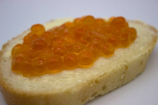 istock Red caviar on sandwiches on the white background 1136444868