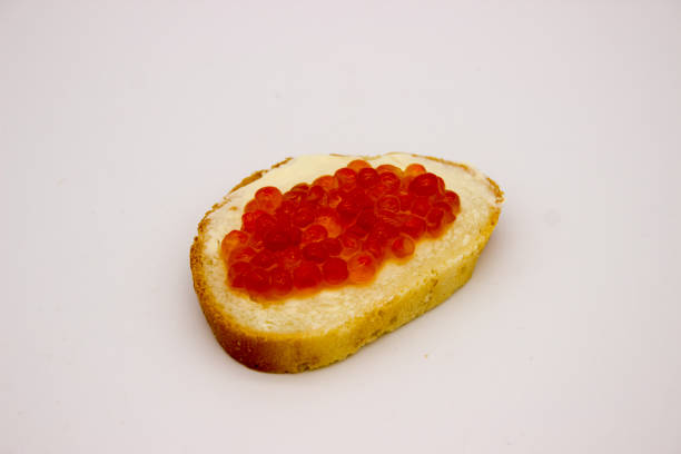 istock Red caviar on sandwiches on the white background 1136445643