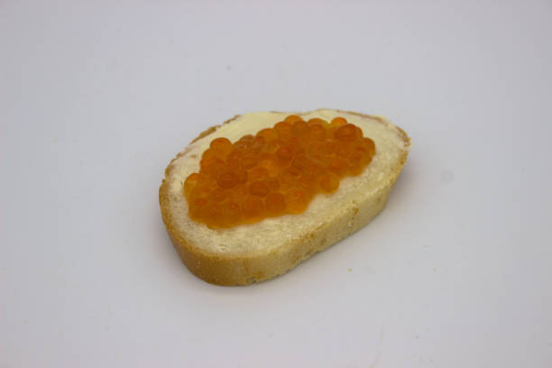 Red caviar on sandwiches on the white background