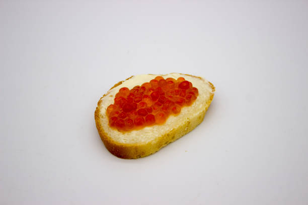 istock Red caviar on sandwiches on the white background 1136445750