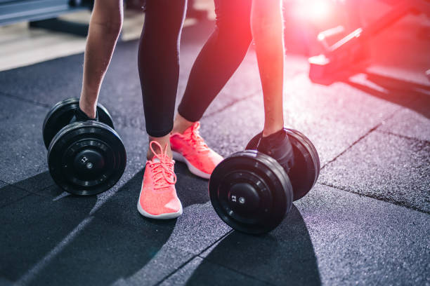 istock Sport workout exercises with dumbbells. 1136445763