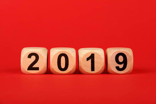 istock Wooden cubes with 2019 word over red 1136445952