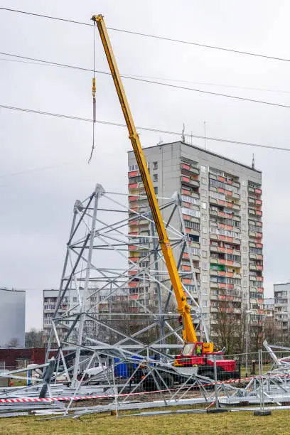 Photo of new high voltage power line steel support assembly in city