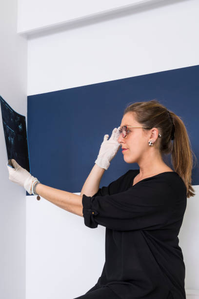 istock female doctor looking at an x-ray 1136447033