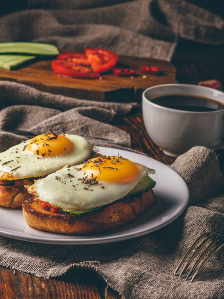 istock Italian toasts with vegetables and fried eggs with cup of coffee 1136447168
