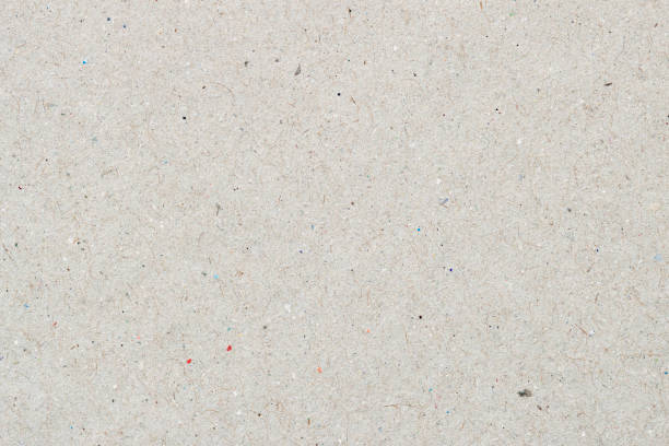 istock Texture of organic light craft paper, background for design with copy space text or image. Recyclable material, has small inclusions of cellulose 1136447982