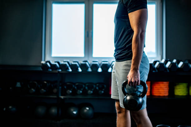 istock Side view of a Young man Cross Training With Kettle Bell 1136449242