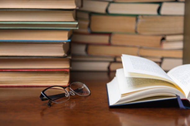 istock open book on the table against the background of books 1136449512