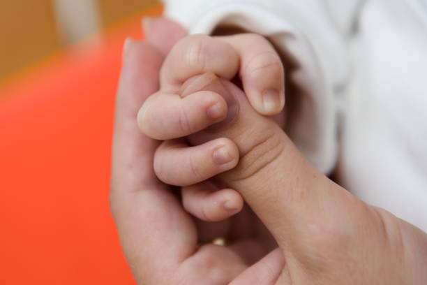 istock Hand of the newborn. 1136450552