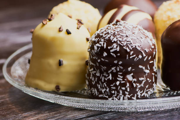 close up of white and dark chocolate covered marshmallows