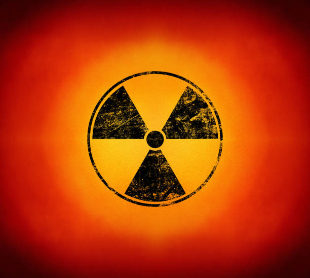 istock Black radioactive sign over yellow background 1136451868