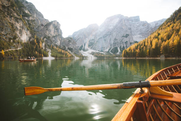 istock Traditional rowing boat on a lake in the Alps in fall 1136453335