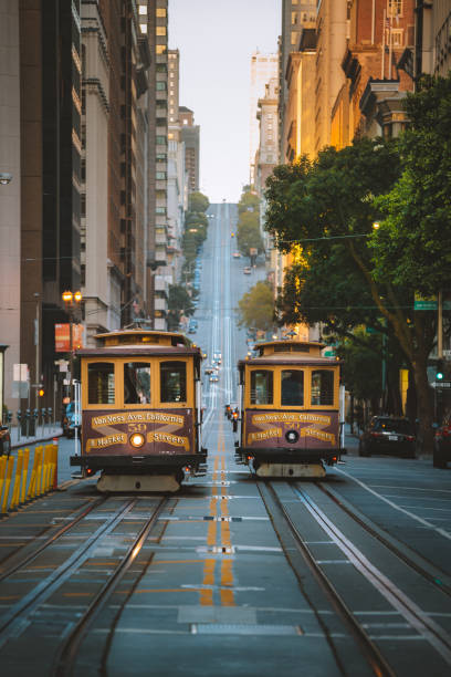 San Francisco Cable Cars on California Street, California, USA Classic panorama view of historic San Francisco Cable Cars on famous California Street at sunset with retro vintage Instagram style VSCO filter effect, central San Francisco, California, USA fishermans wharf san francisco photos stock pictures, royalty-free photos & images