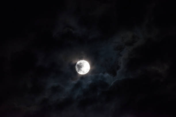istock Moon through the clouds at night, super moon 1136456757