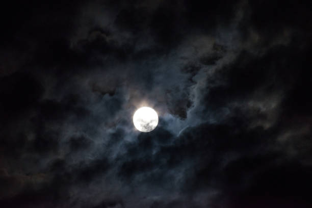 istock Moon through the clouds at night, super moon 1136456759