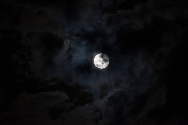 istock Moon through the clouds at night, super moon 1136456784