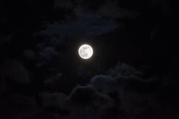 istock Moon through the clouds at night, super moon 1136456788