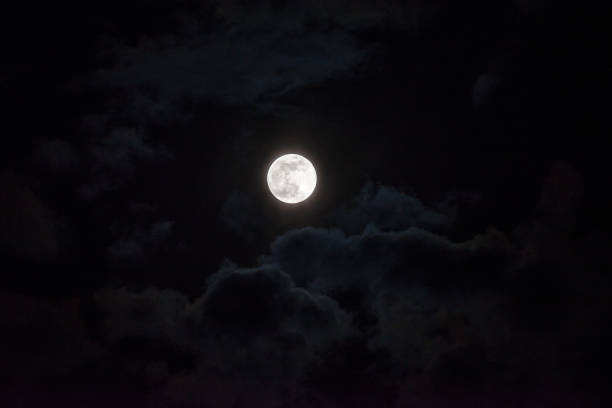 istock Moon through the clouds at night, super moon 1136456791