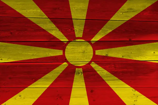 Photo of Macedonia flag painted on old wood plank