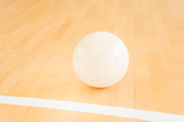 istock Volleyball ball on wooden background 1136460266