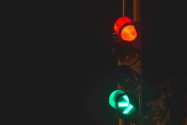 istock Close up traffic light with red light and green arrow for right turn 1136460611