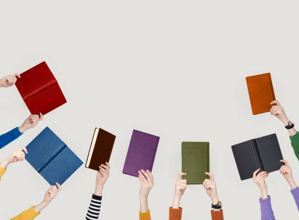 istock The hands of people hold books 1136461686