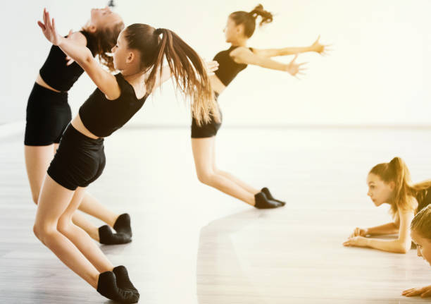 All we want to do is dance. Group of young dancers dancing together at dance class. acting performance stock pictures, royalty-free photos & images