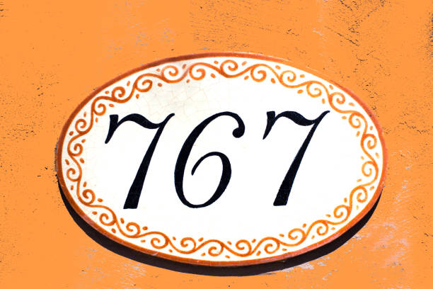 istock Ceramic Number 767 Street Address Tile; Orange Wall 1136462785