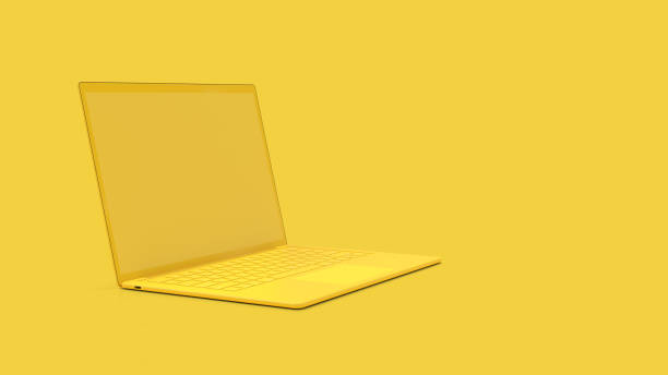 istock Laptop background with blank screen yellow color 1136465943