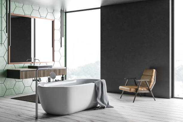 istock Green tile and gray bathroom, tub and sink 1136467045