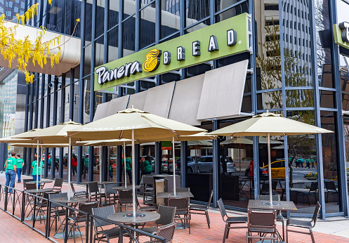 Charlotte, NC, USA-3/16/19: A Panera Bread restaurant in uptown Charlotte, with sidewalk seating.