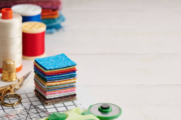 stack of square pieces of colorful fabrics, accessories for quilting - patch textile stack heap imagens e fotografias de stock