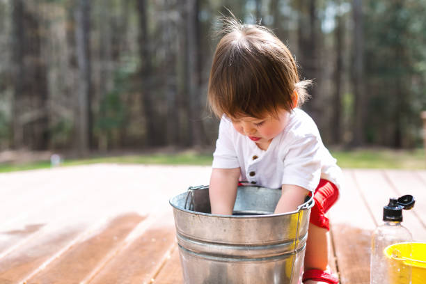 istock Happy toddler boy playing outside 1136476931