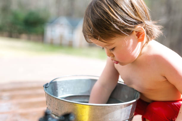 istock Happy toddler boy playing outside 1136476933