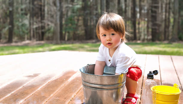 istock Happy toddler boy playing outside 1136476935