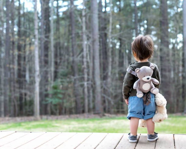 istock Happy toddler boy playing outside 1136476945